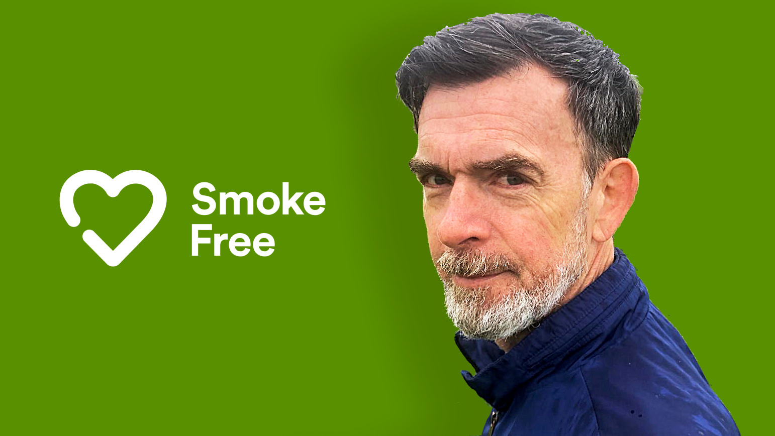 Photo of David Crane in front of Smoke Free App logo
